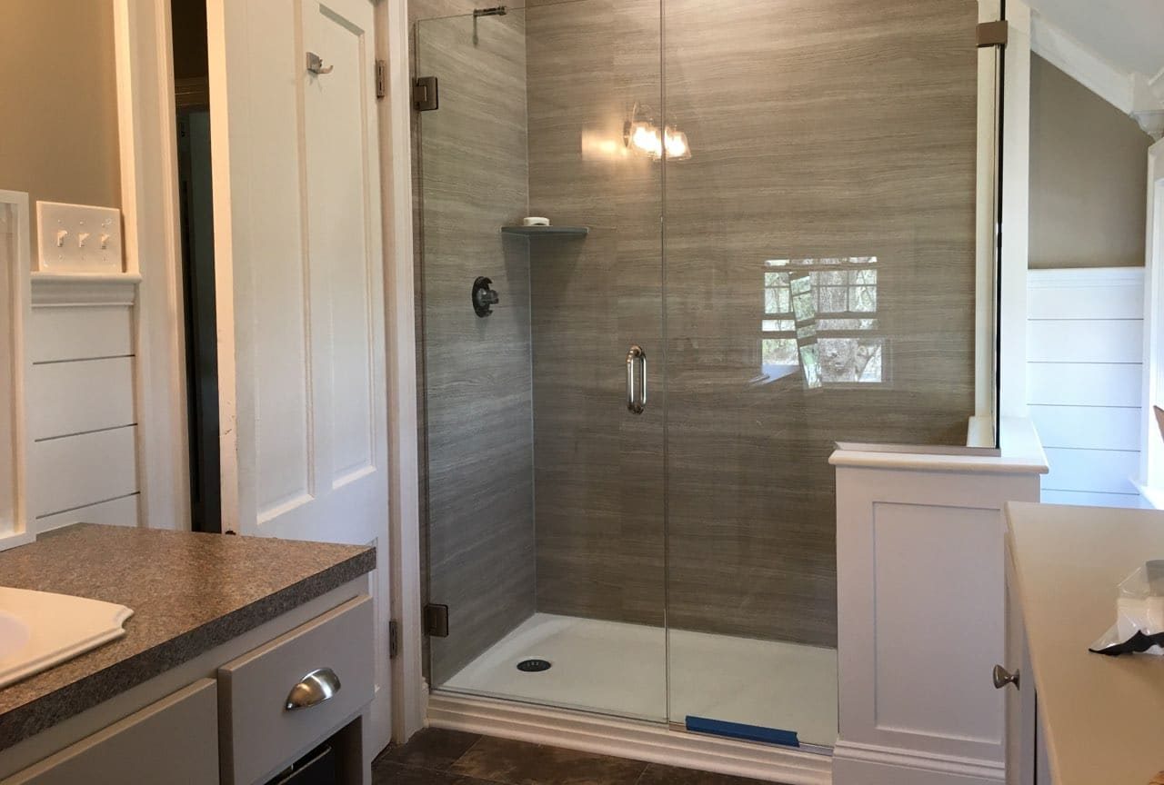 a room with a sink and a mirror