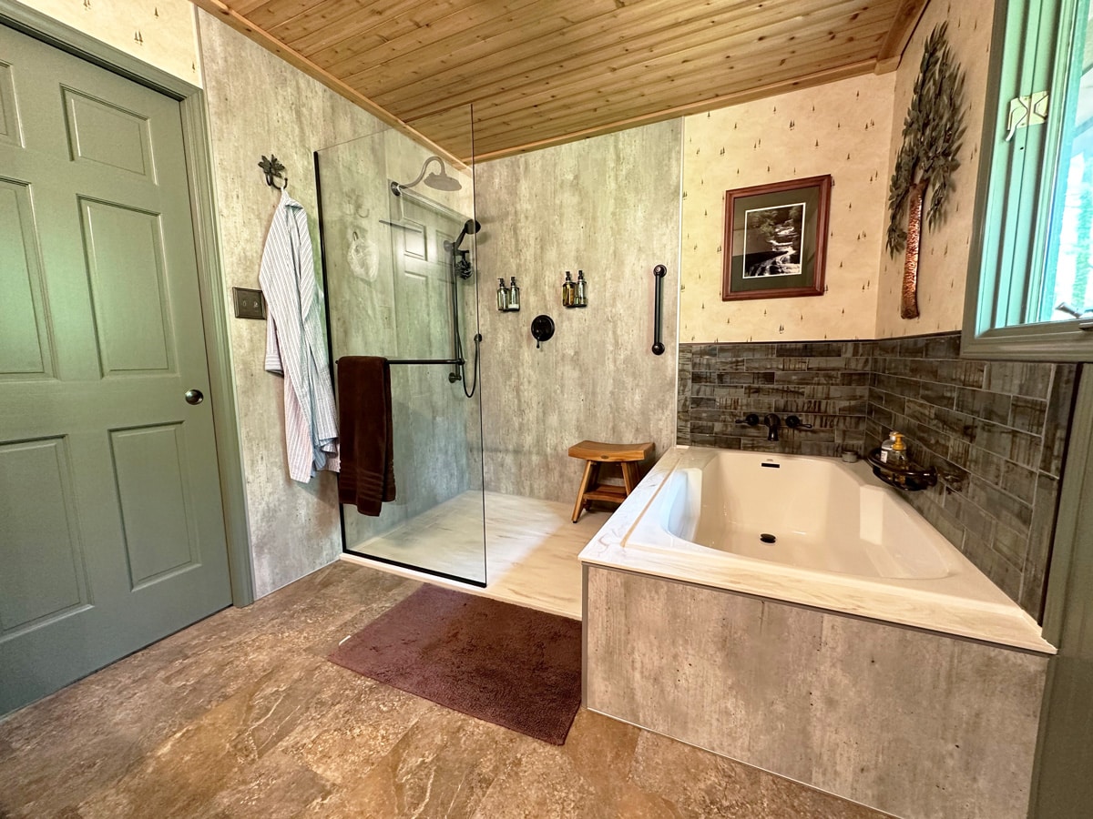 a large tub next to a sink