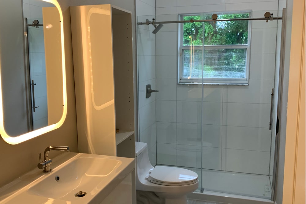 a restroom with a sink and a mirror