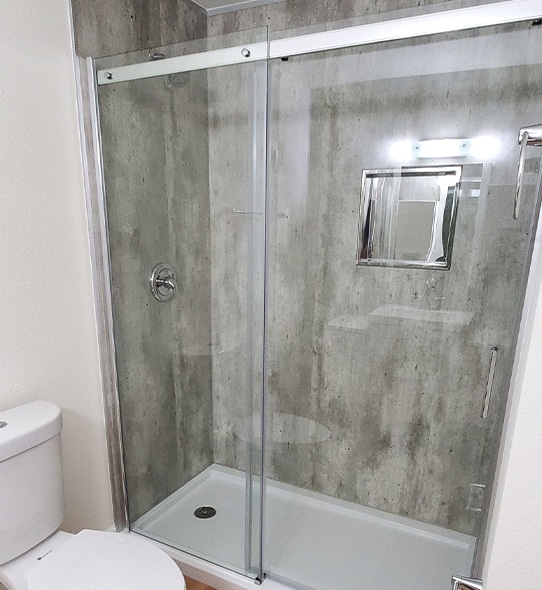 a shower that has a sink and a mirror